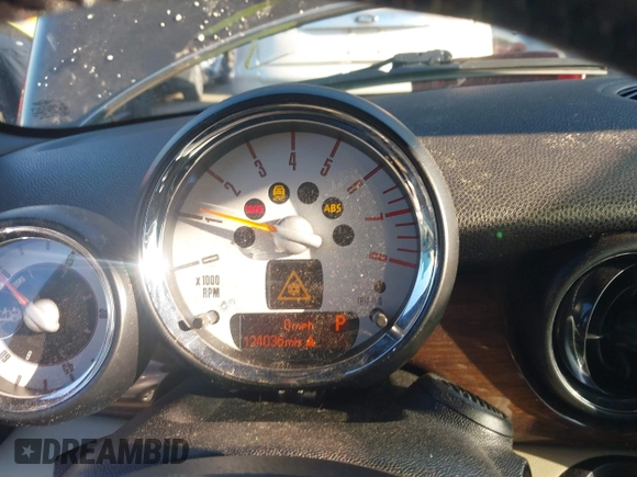2011 MINI Convertible with VIN WMWZN3C55BT133367, listed as a IAAI auction lot 41781374 with 124,036 mi miles and . Bid and sale history available at DreamBid. Image 7.