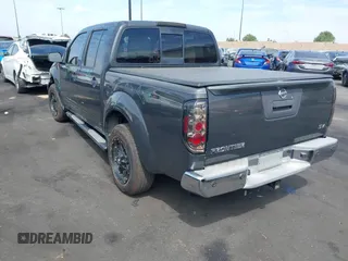 2014 Nissan Frontier SV with VIN 1N6AD0ER8EN756702, listed as a IAAI auction lot 42021294 with 135,143 mi miles and . Bid and sale history available at DreamBid. Image 3.