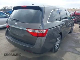 2011 Honda Odyssey EX-L with VIN 5FNRL5H61BB072124, listed as a IAAI auction lot 42115299 with 155,086 mi miles and . Bid and sale history available at DreamBid. Image 4.