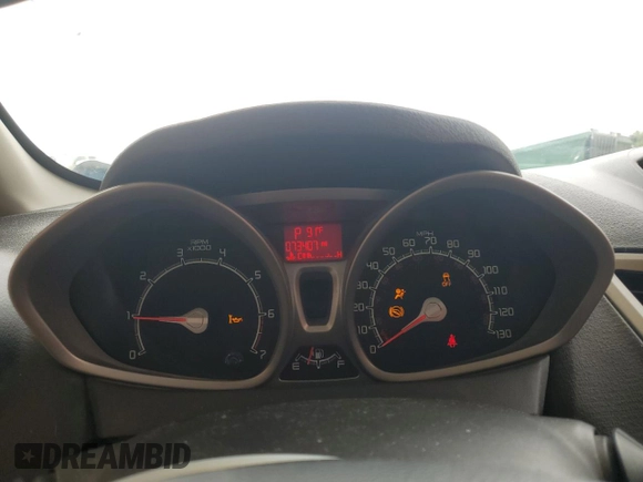 2013 Ford Fiesta SE z VIN 3FADP4EJ7DM216071, wystawiony jako Copart lot #58629155 z przebiegiem 73 407 mil mil oraz Szkoda całkowita • Salvage title. Historia ofert i sprzedaży dostępna na DreamBid. Obrazek 9.
