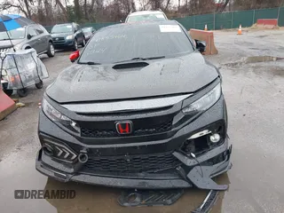 2019 Honda Civic Si z VIN 2HGFC1E51KH704185, wystawiony jako IAAI lot #41855464 z przebiegiem 110 106 mil mil oraz . Historia ofert i sprzedaży dostępna na DreamBid. Obrazek 6.