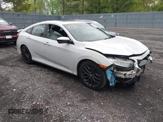 2020 Honda Civic Si z VIN 2HGFC1E51LH702177, wystawiony jako IAAI lot #42226942 z przebiegiem 92 522 mil mil oraz . Historia ofert i sprzedaży dostępna na DreamBid. Obrazek 1.