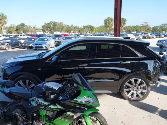 2020 Cadillac XT4 FWD Premium Luxury with VIN 1GYFZCR42LF144359, listed as a IAAI auction lot 42012677 with 34,490 mi miles and . Bid and sale history available at carsss.com. Image 15.