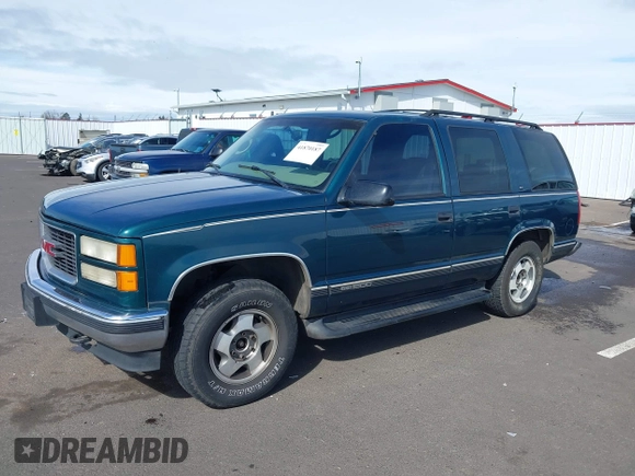 1999 GMC Yukon with VIN 1GKEK13R3XJ717999, listed as a IAAI auction lot 41870187 with 179,855 mi miles. Bid and sale history available at carsss.com. Image 18.