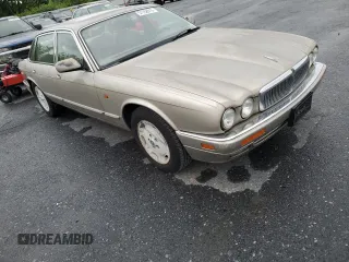 1995 Jaguar XJ with VIN SAJHX174XSC738856, listed as a Copart auction lot 57768915 with Not provided miles and Salvage title. Bid and sale history available at DreamBid. Image 4.