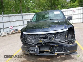 2023 Ford F-150 Lightning Pro with VIN 1FTVW1EL6PWG30061, listed as a IAAI auction lot 42362295 with 22,481 mi miles and . Bid and sale history available at DreamBid. Image 12.