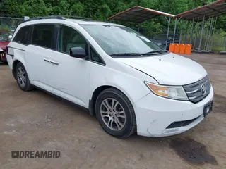 2012 Honda Odyssey EX-L z VIN 5FNRL5H65CB120144, wystawiony jako IAAI lot #42219820 z przebiegiem 124 625 mil mil oraz . Historia ofert i sprzedaży dostępna na DreamBid. Obrazek 1.