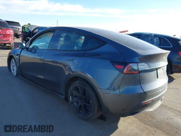 2023 Tesla Model Y Long Range with VIN 7SAYGAEEXPF714760, listed as a IAAI auction lot 41748398 with 49,802 mi miles and . Bid and sale history available at DreamBid. Image 3.