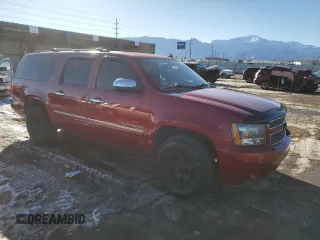 2014 Chevrolet Suburban LTZ with VIN 1GNSCKE08ER168239, listed as a Copart auction lot 42143915 with 137,902 mi miles and Salvage title. Bid and sale history available at DreamBid. Image 4.