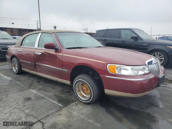 1999 Lincoln Town Car Signature with VIN 1LNHM82W7XY612906, listed as a Copart auction lot 50777435 with 110,414 mi miles and Salvage Title. Bid and sale history available at carsss.com. Image 4.
