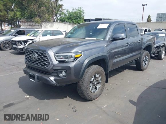 2023 Toyota Tacoma SR with VIN 3TMCZ5AN0PM635933, listed as a IAAI auction lot 42543126 with 32,960 mi miles and . Bid and sale history available at DreamBid. Image 2.