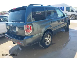 2006 Honda Pilot EX-L with VIN 5FNYF28556B003516, listed as a IAAI auction lot 42013495 with 207,443 mi miles. Bid and sale history available at carsss.com. Image 4.