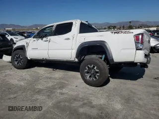 2020 Toyota Tacoma SR5 with VIN 3TMAZ5CN8LM115056, listed as a Copart auction lot 46948805 with 87,713 mi miles and Salvage title. Bid and sale history available at DreamBid. Image 2.