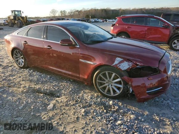 2012 Jaguar XJ with VIN SAJWA1CB3CLV37685, listed as a Copart auction lot 87586005 with 59,885 mi miles and Salvage title. Bid and sale history available at DreamBid. Image 4.