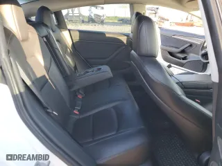 2021 Tesla Model 3 Standard Range Plus with VIN 5YJ3E1EA9MF100403, listed as a Copart auction lot 48561545 with 68,996 mi miles and Salvage Title. Bid and sale history available at carsss.com. Image 10.