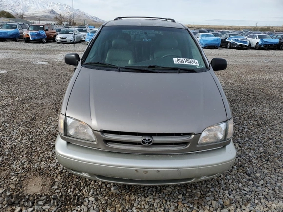 1999 Toyota Sienna LE with VIN 4T3ZF13C7XU133135, listed as a Copart auction lot 80618034 with 200,910 mi miles and Salvage Title. Bid and sale history available at carsss.com. Image 5.