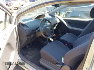 2009 Toyota Yaris with VIN JTDJT903495263456, listed as a IAAI auction lot 42135019 with 219,704 mi miles. Bid and sale history available at carsss.com. Image 5.