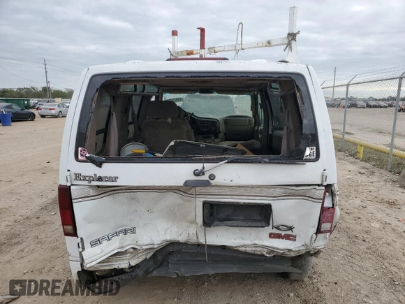 2000 GMC Safari z VIN 1GDDM19W3YB518506, wystawiony jako Copart lot #80923314 z przebiegiem 303 166 mil mil oraz Szkody całkowita. Historia ofert i sprzedaży dostępna na DreamBid. Obrazek 6.