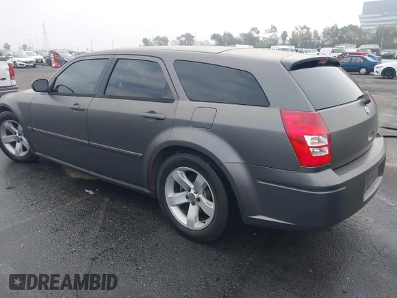2005 Dodge Magnum RT with VIN 2D4GV58265H500284, listed as a IAAI auction lot 41194672 with 104,894 mi miles. Bid and sale history available at carsss.com. Image 3.