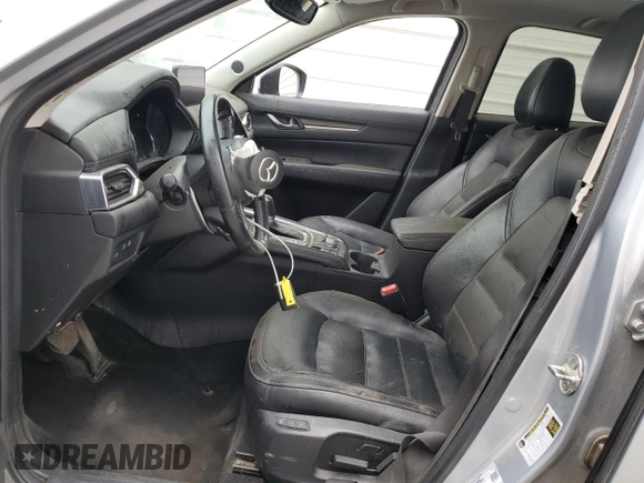 2021 Mazda CX-5 Grand Touring z VIN JM3KFADM7M1339081, wystawiony jako Copart lot #58913585 z przebiegiem Nie podano mil oraz Szkoda całkowita • Salvage title. Historia ofert i sprzedaży dostępna na DreamBid. Obrazek 7.