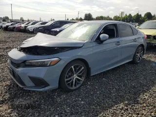 2022 Honda Civic Touring with VIN 2HGFE1F95NH308244, listed as a Copart auction lot 59809525 with 58,635 mi miles and Salvage title. Bid and sale history available at DreamBid. Image 1.
