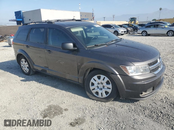 2014 Dodge Journey American Value with VIN 3C4PDCABXET277897, listed as a Copart auction lot 60566735 with 113,343 mi miles and Salvage title. Bid and sale history available at DreamBid. Image 4.