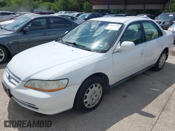 2002 Honda Accord LX z VIN 1HGCG56482A067556, wystawiony jako IAAI lot #42494292 z przebiegiem 209 511 mil mil oraz . Historia ofert i sprzedaży dostępna na DreamBid. Obrazek 2.