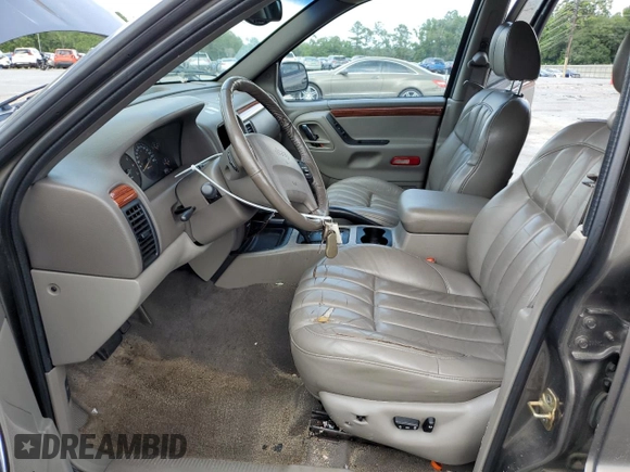 1999 Jeep Grand Cherokee Limited with VIN 1J4GW68S6XC713297, listed as a Copart auction lot 55264384 with 98,912 mi miles and Salvage Title. Bid and sale history available at carsss.com. Image 7.