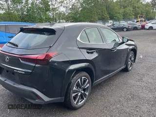 2025 Lexus UX 300h with VIN JTHUCJDH8S2003698, listed as a Copart auction lot 56182345 with 1,111 mi miles and Salvage Title. Bid and sale history available at DreamBid. Image 4.