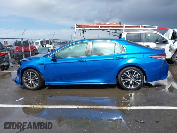 2019 Toyota Camry LE z VIN 4T1B11HK1KU282870, wystawiony jako IAAI lot #41799625 z przebiegiem 63 977 mil mil oraz . Historia ofert i sprzedaży dostępna na DreamBid. Obrazek 14.