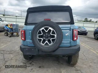2023 Ford Bronco z VIN 1FMEE5DP9PLB17477, wystawiony jako Copart lot #58829615 z przebiegiem 22 069 mil mil oraz Szkoda całkowita • Salvage title. Historia ofert i sprzedaży dostępna na DreamBid. Obrazek 6.