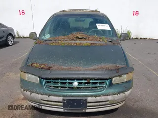 1999 Plymouth Voyager Grand SE z VIN 1P4GP44G0XB579719, wystawiony jako IAAI lot #41981925 z przebiegiem 163 940 mil mil oraz . Historia ofert i sprzedaży dostępna na DreamBid. Obrazek 6.