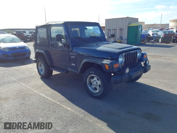 2002 Jeep Wrangler Sport z VIN 1J4FA49SX2P760671, wystawiony jako IAAI lot #41861841 z przebiegiem 125 728 mil mil oraz . Historia ofert i sprzedaży dostępna na DreamBid. Obrazek 1.