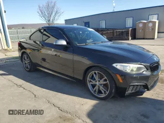 2015 BMW 2 Series M235i xDrive with VIN WBA1J9C58FVX98415, listed as a Copart auction lot 49793655 with 110,169 mi miles and Salvage Title. Bid and sale history available at DreamBid. Image 4.