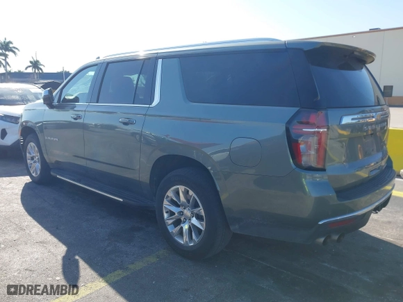 2023 Chevrolet Suburban Premier with VIN 1GNSCFKD4PR378869, listed as a IAAI auction lot 41802386 with 58,569 mi miles. Bid and sale history available at carsss.com. Image 3.