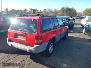 1997 Jeep Grand Cherokee Laredo with VIN 1J4GZ58S0VC550242, listed as a IAAI auction lot 41032114 with 185,307 mi miles. Bid and sale history available at carsss.com. Image 4.