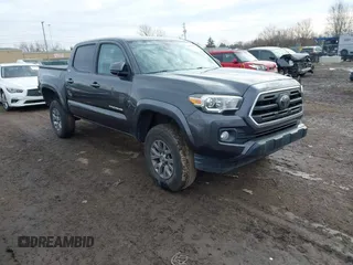 2018 Toyota Tacoma SR5 with VIN 3TMAZ5CN5JM068632, listed as a IAAI auction lot 41634912 with 73,989 mi miles and . Bid and sale history available at DreamBid. Image 1.