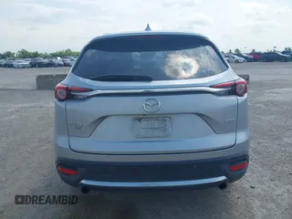 2016 Mazda CX-9 Signature with VIN JM3TCBEY9G0117785, listed as a IAAI auction lot 42331883 with 115,096 mi miles and . Bid and sale history available at DreamBid. Image 16.