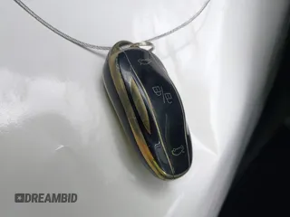 2014 Tesla Model S 60 z VIN 5YJSA1H1XEFP44397, wystawiony jako IAAI lot #42140917 z przebiegiem 136 515 mil mil oraz . Historia ofert i sprzedaży dostępna na DreamBid. Obrazek 11.