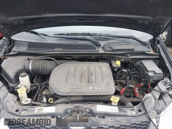 2013 Dodge Grand Caravan SXT with VIN 2C4RDGCG0DR552784, listed as a IAAI auction lot 42116395 with 96,917 mi miles and . Bid and sale history available at DreamBid. Image 10.