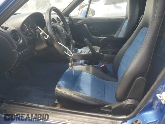 1999 Mazda MX-5 Miata with VIN JM1NB353XX0134898, listed as a Copart auction lot 63429475 with 140,595 mi miles and Clean title. Bid and sale history available at DreamBid. Image 7.