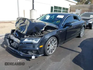 2014 Audi A7 Prestige with VIN WAU2GAFC5EN012583, listed as a IAAI auction lot 42561824 with Not provided miles and . Bid and sale history available at DreamBid. Image 2.