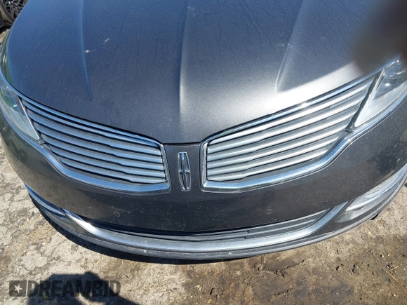 2016 Lincoln MKZ z VIN 3LN6L2G90GR632116, wystawiony jako IAAI lot #41836442 z przebiegiem 121 223 mil mil oraz . Historia ofert i sprzedaży dostępna na DreamBid. Obrazek 17.