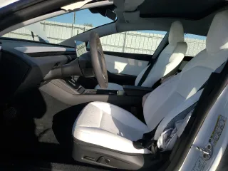 2025 Tesla Model 3 Long Range with VIN 5YJ3E1EAXSF935004, listed as a Copart auction lot 52233195 with 5,873 mi miles and Salvage Title. Bid and sale history available at carsss.com. Image 7.
