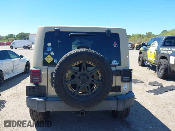 2011 Jeep Wrangler Sahara with VIN 1J4AA5D13BL562732, listed as a IAAI auction lot 41838520 with 148,359 mi miles and . Bid and sale history available at DreamBid. Image 17.