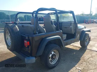 2004 Jeep Wrangler SE with VIN 1J4FA29144P797861, listed as a IAAI auction lot 42624721 with 156,867 mi miles and . Bid and sale history available at DreamBid. Image 4.