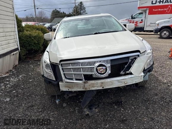 2013 Cadillac XTS Platinum z VIN 2G61V5S33D9173441, wystawiony jako IAAI lot #41902672 z przebiegiem 103 044 mil mil oraz . Historia ofert i sprzedaży dostępna na DreamBid. Obrazek 6.