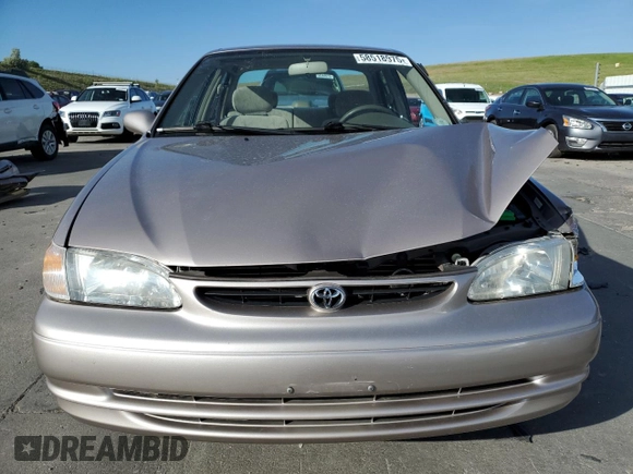 1999 Toyota Corolla VE с VIN 1NXBR18E9XZ210292, выставлен на аукционе Copart как лот 58518975 с пробегом 80 953 миль миль и Списание • Salvage title. История ставок и продаж доступна на DreamBid. Изображение 5.