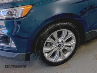 2020 Ford Edge Titanium z VIN 2FMPK3K91LBB37761, wystawiony jako IAAI lot #42829390 z przebiegiem 90 117 mil mil oraz . Historia ofert i sprzedaży dostępna na DreamBid. Obrazek 31.