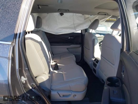 2017 Honda Pilot EX-L with VIN 5FNYF6H59HB101815, listed as a IAAI auction lot 41704661 with 130,479 mi miles and . Bid and sale history available at DreamBid. Image 8.